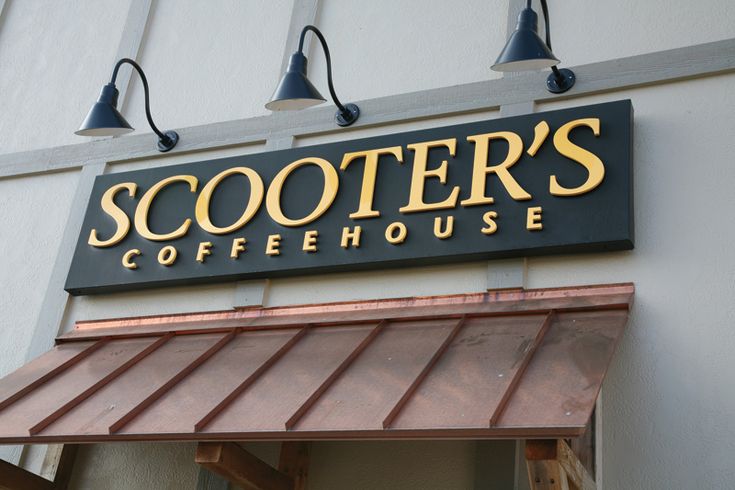 the sign for scooter's coffeehouse hangs on the wall