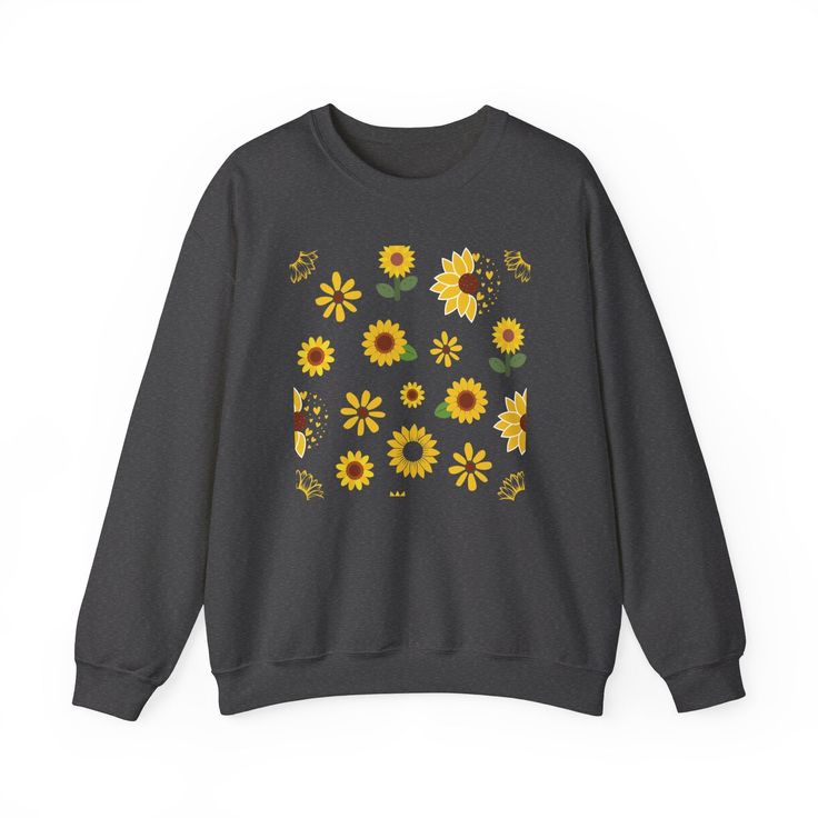 This vibrant Sunflower Burst Crewneck Sweatshirt boasts a cheery and bright design, perfect for adding a touch of summer fun to your wardrobe. Featuring a beautiful array of sunflowers and other spring florals, this pretty sweater is sure to make a statement. Stay stylish and comfortable all season long with its soft, long sleeve design. Ideal for any situation, a unisex heavy blend crewneck sweatshirt is pure comfort. These garments are made from polyester and cotton. This combination helps des Summer Crew Neck Sweater With Floral Print, Summer Floral Print Crew Neck Sweater, Casual Printed Sweater For Spring, Cute Yellow Sweatshirt For Fall, Casual Summer Sweater With Floral Print, Fall Cotton Sweater With Floral Print, Fall Cotton Floral Print Sweater, Trendy Summer Sweater With Floral Print, Cute Floral Print Tops For Fall