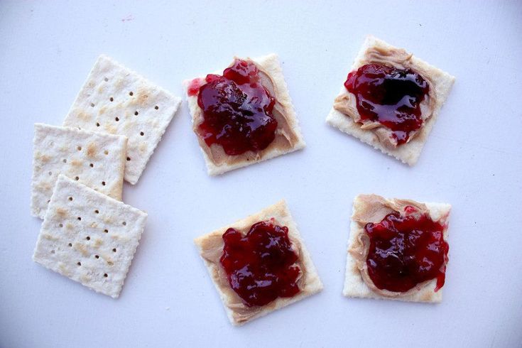 crackers with jam and cheese on them