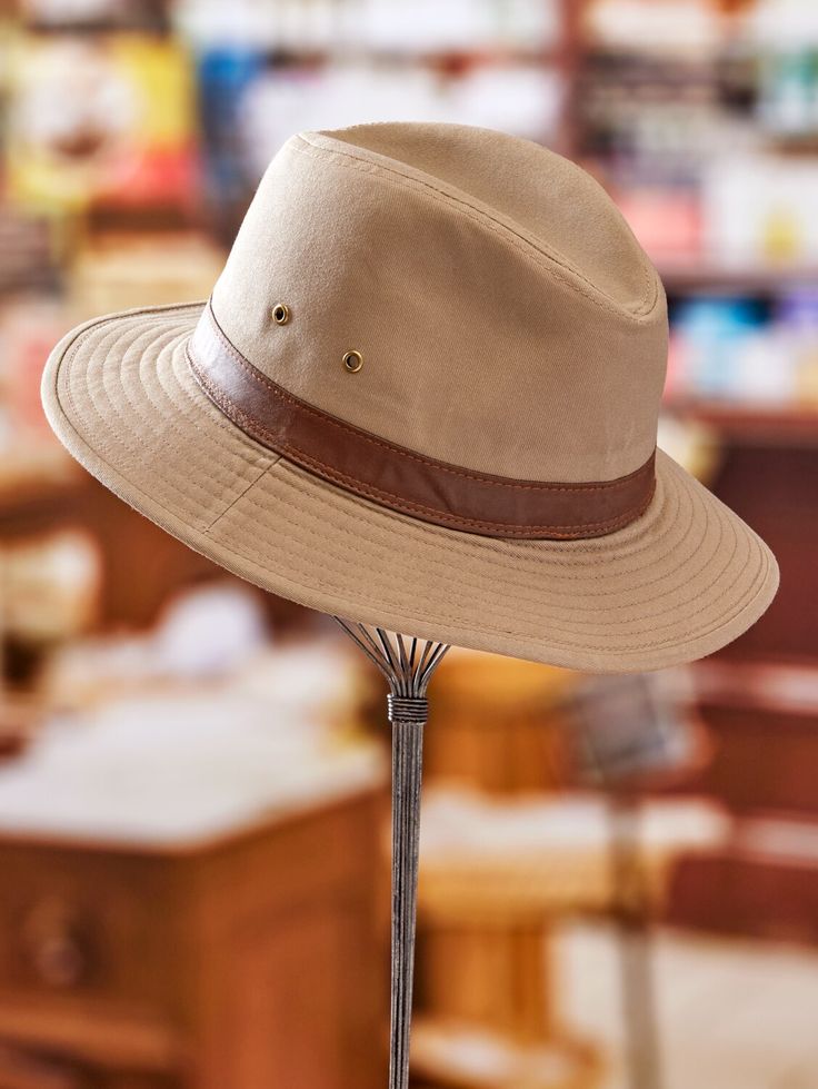 Inspired by Indian Jones (remember him?), this hat is built for adventure - whether that means heading out for a hike in the woods or venturing out to the wilds of a local restaurant. The handsome hat is sturdily crafted from water-repellant cotton twill in a classic style that looks good on just about everyone. Available in a variety of sizes for a custom fit. Tightly woven twill offers 50+UPF Garment-washed for a rugged, weathered look Finished with a 2-1/2" wide faux leather hatband Spot clea Outdoor Canvas Bucket Hat With Short Brim, Outdoor Brimmed Canvas Hats, Canvas Hats With Flat Brim For Outdoor, Outdoor Canvas Brimmed Hat, Classic 5-panel Hat For Outdoor, Casual Hunting Hat With Flat Brim, Classic Brown Hat For Outdoor Activities, Classic Fedora With Short Brim For Outdoor Activities, Classic Short Brim Hat For Outdoor Activities