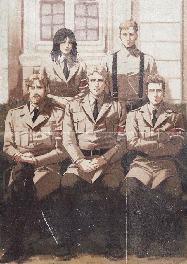 an old photo of men in uniforms posing for a picture