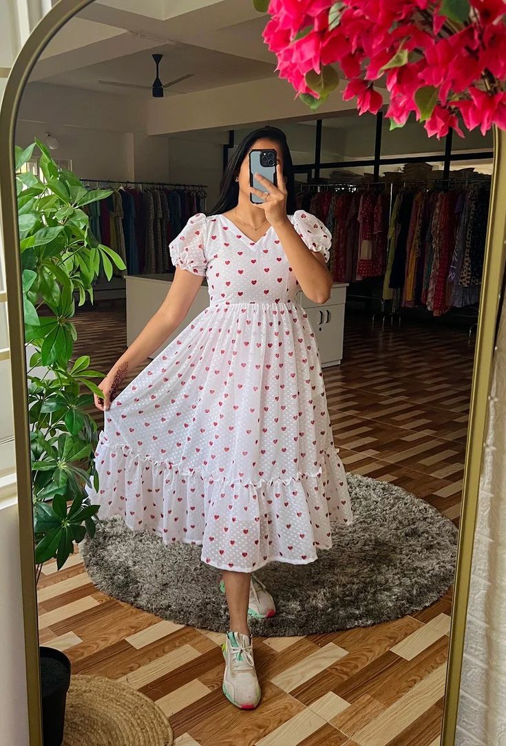 *Rate - 850/- free shipping** 👗*Description*👗 *White and red heart pattern digital print georgette dobby fabric dress with V neckline, puff sleeves and very comfortable and stylish wear* 👚*SIZE:S,M,L,XL,XXL* 👗*Regular Fit* 👗*SPECIFICATION*👗 *Shape: A-line* *Sleeve Length: above elbow* *Sleeve Style: puff sleeve* *Length: (46)* 👗*MATERIAL DETAILS*👗 *Colour: White* *Material Type: dobby georgette* *Lining: It has lining* *Weight - 400 grm* *Ready To Dispatch* *Be Happy With Frock Designs For Women, Red Heart Pattern, Georgette Material, Red Heart Patterns, Dobby Fabric, Above Elbow, Trendy Dress Outfits, Frock Design, Heart Pattern