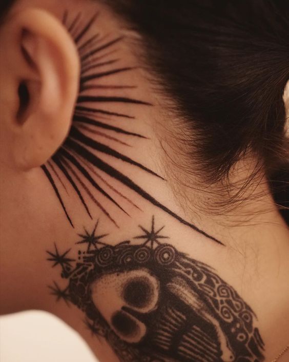 a woman's neck with a tattoo on it