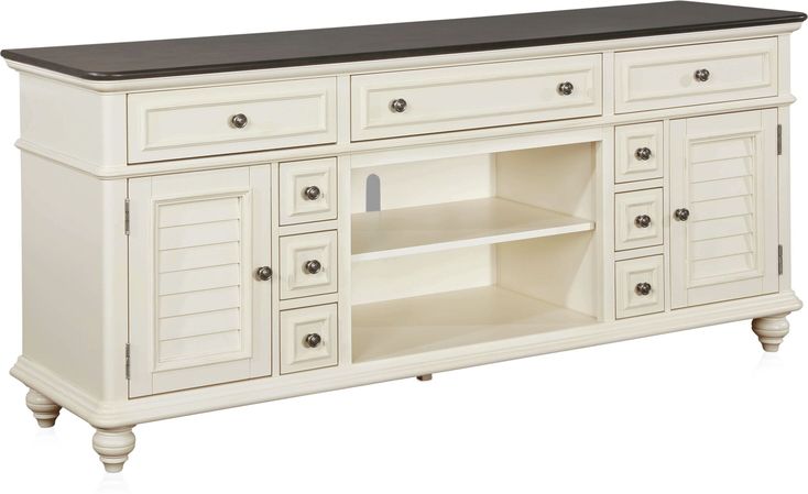 a large white cabinet with drawers and shelves on the sideboard is against a white background