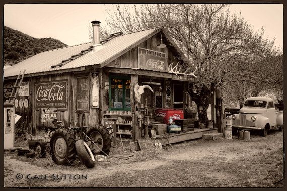 an old truck parked in front of a building