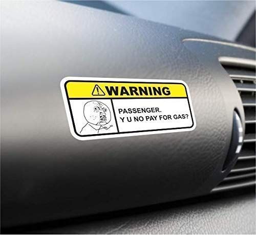 a warning sticker on the dashboard of a car