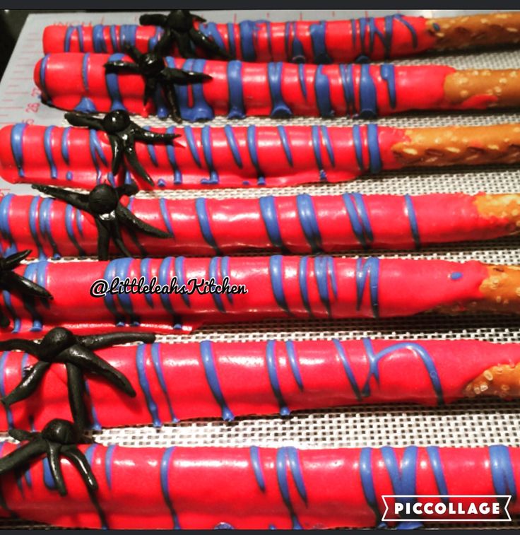 red, blue and black candy canes with sprinkles on them