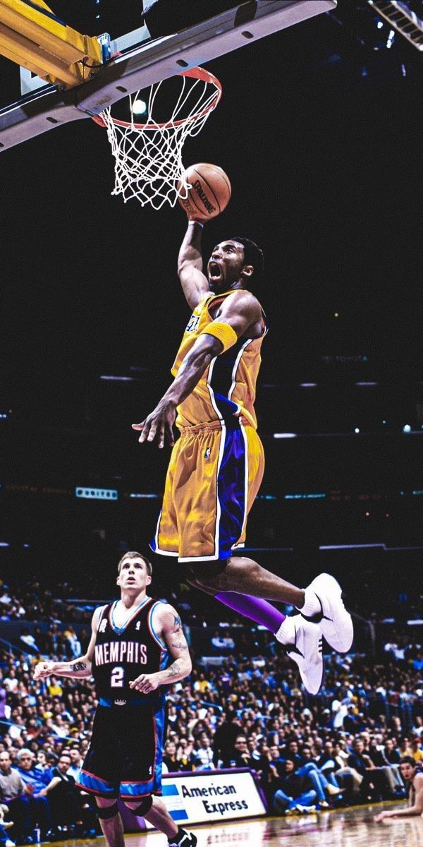 a basketball player jumping up to dunk the ball