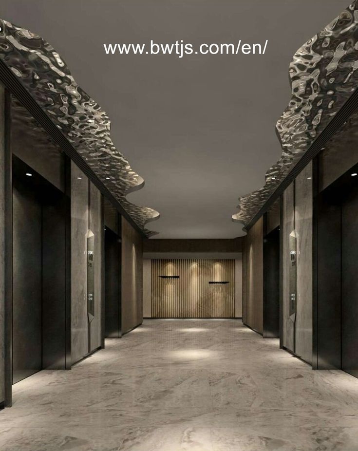 an empty hallway with marble floors and walls