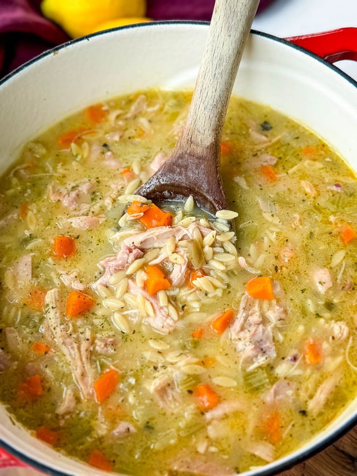 a white bowl filled with chicken and rice soup