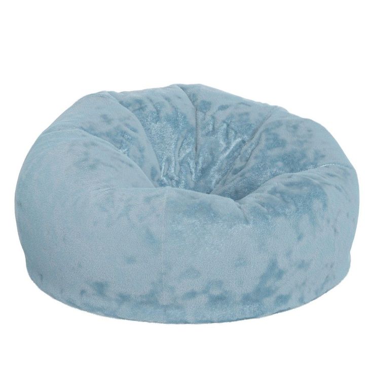 the blue bean bag chair is made from plush material and has a large, round cushion on