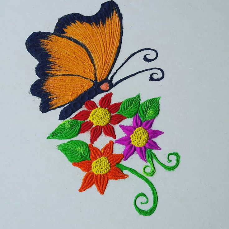 an embroidered butterfly and flowers on a white surface