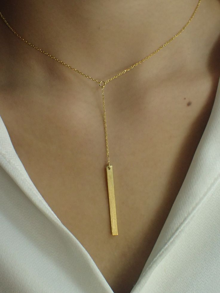 Dainty Bar Necklace / Skinny Vertical Bar / Silver Gold plated Necklace / Simple Everyday Necklace / Bridesmaids Gift About Features- * Made to order * Materials: 925 Sterling Silver * Gold color: Yellow Gold Plating, White Gold Plating, and Rose Gold Plating * Bar dimensions: 36mm long x 3mm wide * Layaway Plan Available * SKU: N173 For Ready-to-ship items search here, https://etsy.me/39BDvMS As a reference, I've included the widths of coins for your visual reference: Dime = 1.25mm Penny = 1.4m Minimalist Dangle Necklaces For Parties, Gold Pendant Lariat Necklace As Gift, Minimalist Square Pendant Necklace For Wedding, Minimalist Yellow Gold Necklace For Party, Minimalist Gold Plated Necklace For Party, Minimalist Gold-plated Necklace For Party, Gold Pendant Lariat Necklace For Anniversary, Gold Necklace With Rectangular Pendant For Party, Gold Square Pendant Jewelry For Wedding