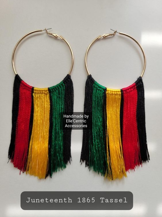 the hoop earrings are decorated with multicolored tassels