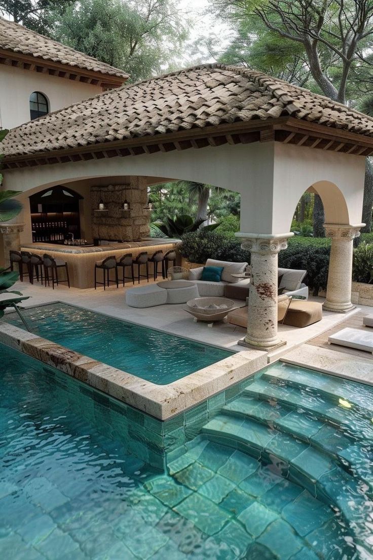 an outdoor living area next to a swimming pool