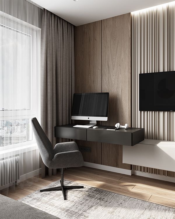 a living room with a tv, desk and chair in front of a large window