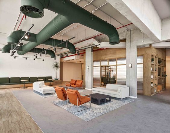 an office lobby with couches and chairs