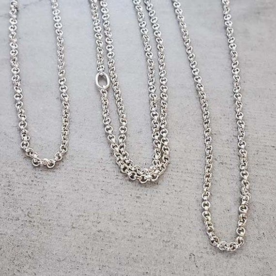 "This necklace is a result of my daughter needing something to hold her engagement ring around her neck while she is at work.  Also perfect for nurses, doctors, expectant mothers or anyone else that needs to remove their rings for work. The sturdy 2.1mm rolo chain is 50\" long with 1 soldered oval link to finish the chain.  There is no clasp to reduce the chance of it breaking.   Just place the chain around your neck.  While holding your ring in front of you, drop the chain through the center. Everyday Round Rolo Chain Jewelry, Everyday Rolo Chain Jewelry, Sterling Silver Jewelry With Rolo Chain, Hypoallergenic Sterling Silver Oval Link Jewelry, Adjustable Round Rolo Chain Jewelry, Adjustable Rolo Chain Jewelry, Silver Cable Chain Wedding Jewelry, Adjustable Jewelry With Rolo Chain, Silver Rolo Chain For Jewelry Making