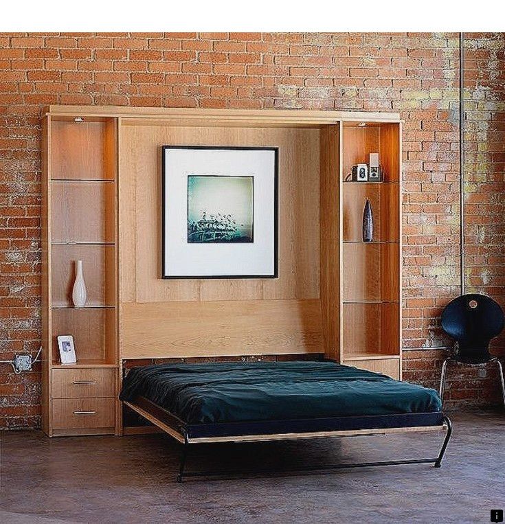 a bed sitting in front of a brick wall next to a book shelf filled with books