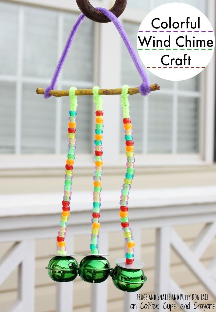 colorful wind chime craft made with plastic beads and twinkies on a stick