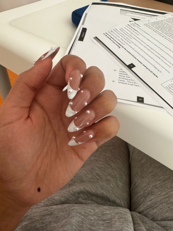 Nails W Pearls On Them, Square French Tip Acrylic Nails With Pearls, Acrylic Nail Designs Perl, White Nail Inspo With Gems, White Tip Nails With Gems, Coffin French Tip Nails With Pearls, French Tips Nails With Pearls, White Pearls Nails, Birthday Nails With Pearls