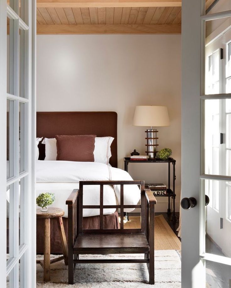 an open door leading to a bedroom with a bed