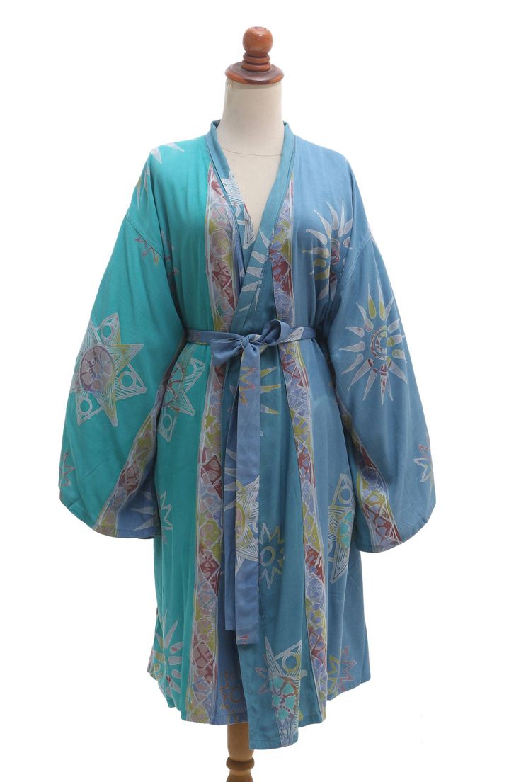 Seafoam green and cerulean blue create the pleasant color combination on Desak Nyoman Parwati's comfy bathrobe perfect for a tranquil spa day. Crafted from 100% rayon the robe features a hand-stamped batik motif inseam pockets and a matching belt tie for a snug fit. Tranquil Spa, Batik Motif, Belt Tie, Cerulean Blue, Seafoam Green, Spa Day, Color Combination, Hand Stamped, Snug Fit