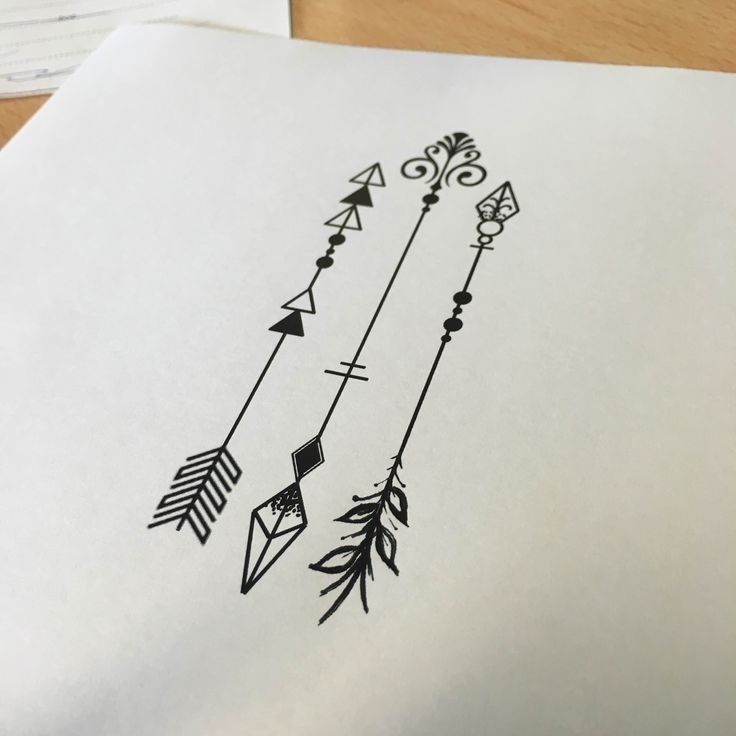 an ink drawing of arrows on paper