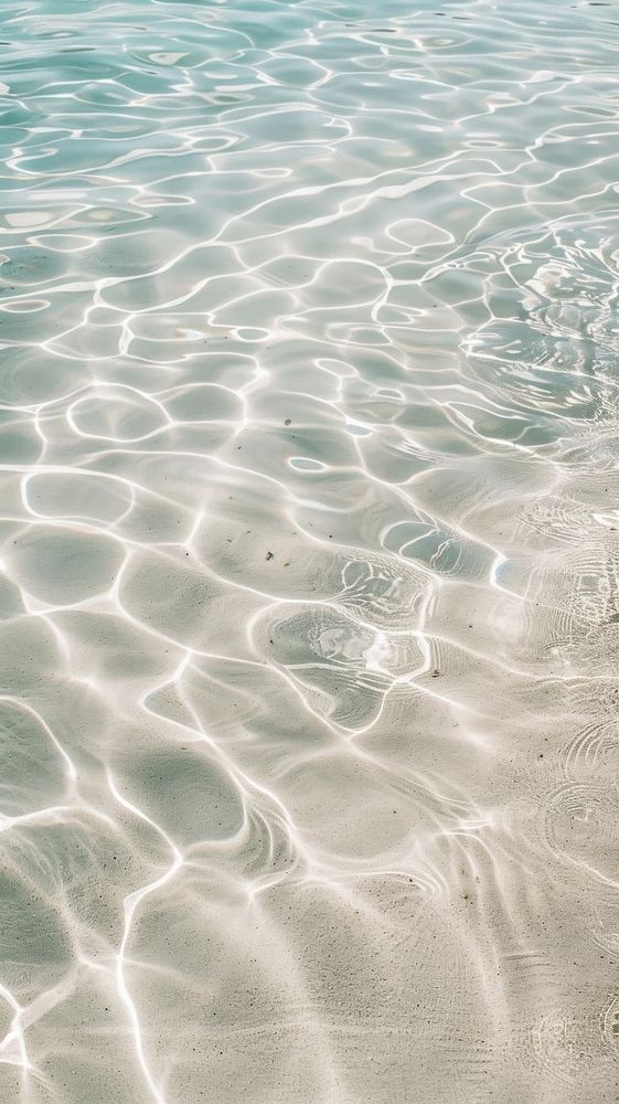 the water is so clear that it looks like ripples are coming from the ocean