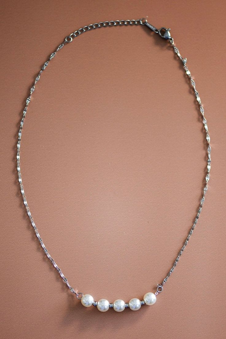 This dainty silver necklace is all one length. Its chain is simple but ends with white pearls. Length: 8 1/2” Dainty Silver Necklace, Necklace With Pearls, Dainty Chain Necklace, Dainty Chain, Accessories Jewelry Earrings, Bottom Clothes, Silver Pearls, Backpack Purse, Book Gifts