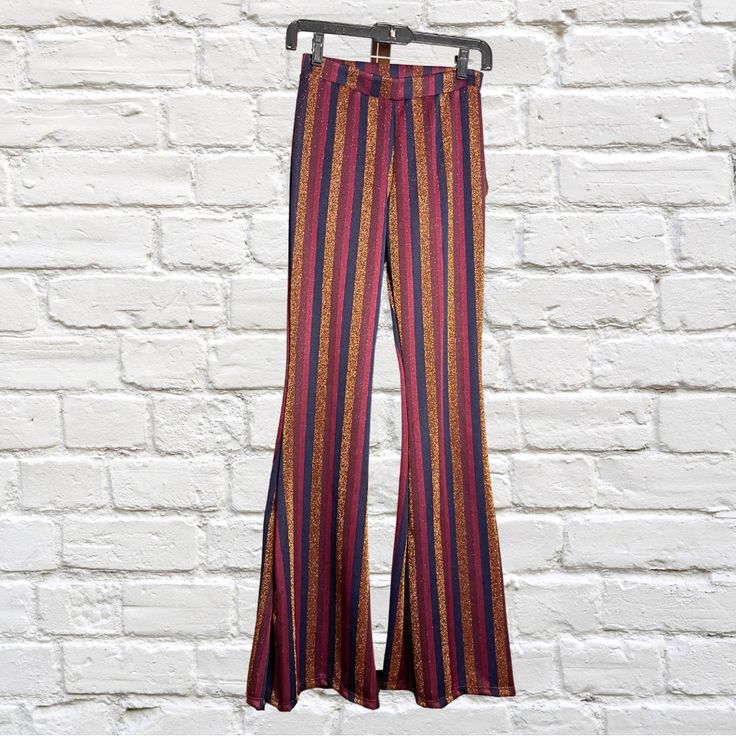 New Altar’d State Flare Striped Metallic Pants Nwt Size Xs (Extra Small) Stripe Colors: Shades Of Red, Navy Blue, Glittery Gold. Approximate Measurements, Taken While Flat: Waist: 12 1/2” Rise: 9 1/2” Inseam: 34” Rn# 157389 Cut# 10722 Style# H1027l064jd 89% Polyester 8% Metallic 3% Spandex Questions? Leave A Comment Below! Multicolor Stretch Bottoms For Night Out, Fitted Multicolor Pants For Fall, Striped Stretch Bottoms For Night Out, Fitted Wide Leg Multicolor Pants, Fitted Multicolor Wide Leg Pants, Striped Fitted Wide-leg Bottoms, Striped Fitted Wide-leg Pants, Fitted Striped Wide-leg Pants, Multicolor Party Trousers