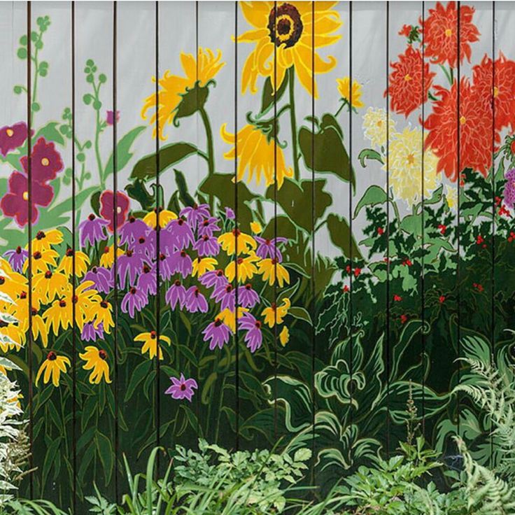 an image of colorful flowers painted on the side of a fence with wood slats