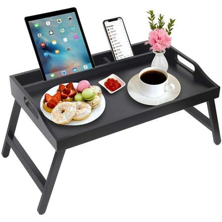 a tray with food and drink on it next to a laptop computer, phone, and tablet