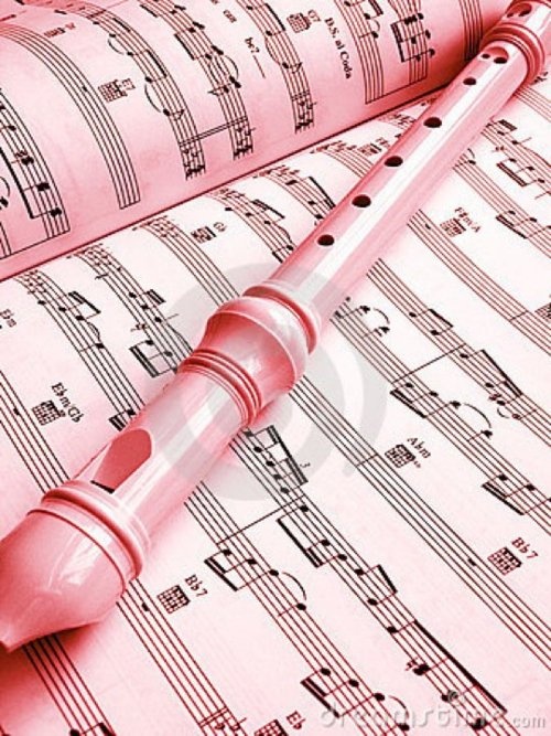 sheet music with pink microphones on top of it and red rubber mallets in the foreground