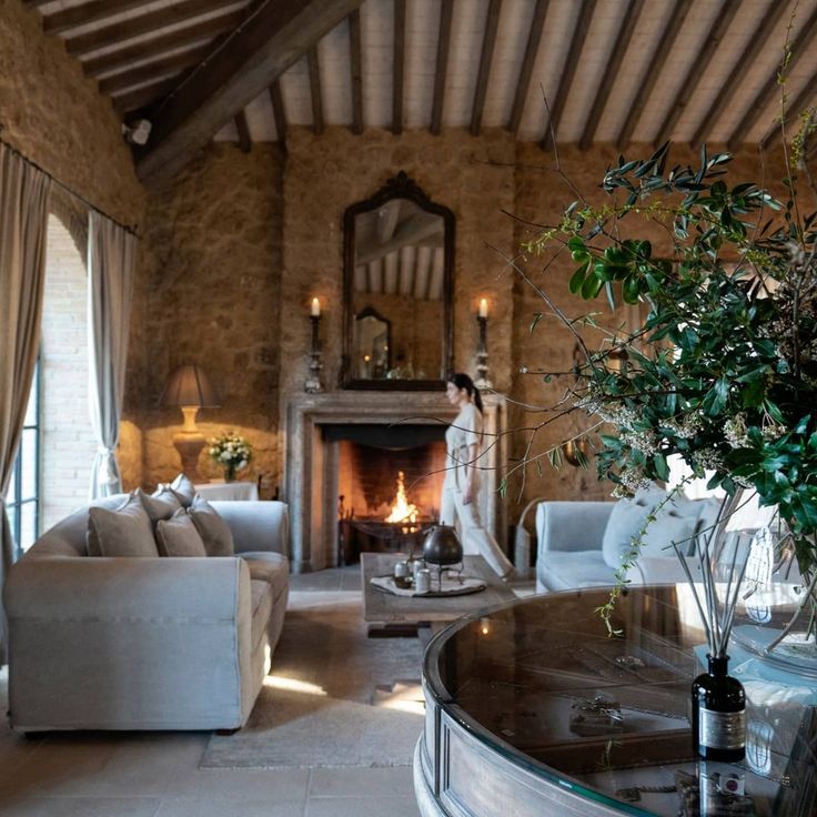 a living room filled with furniture and a fire place