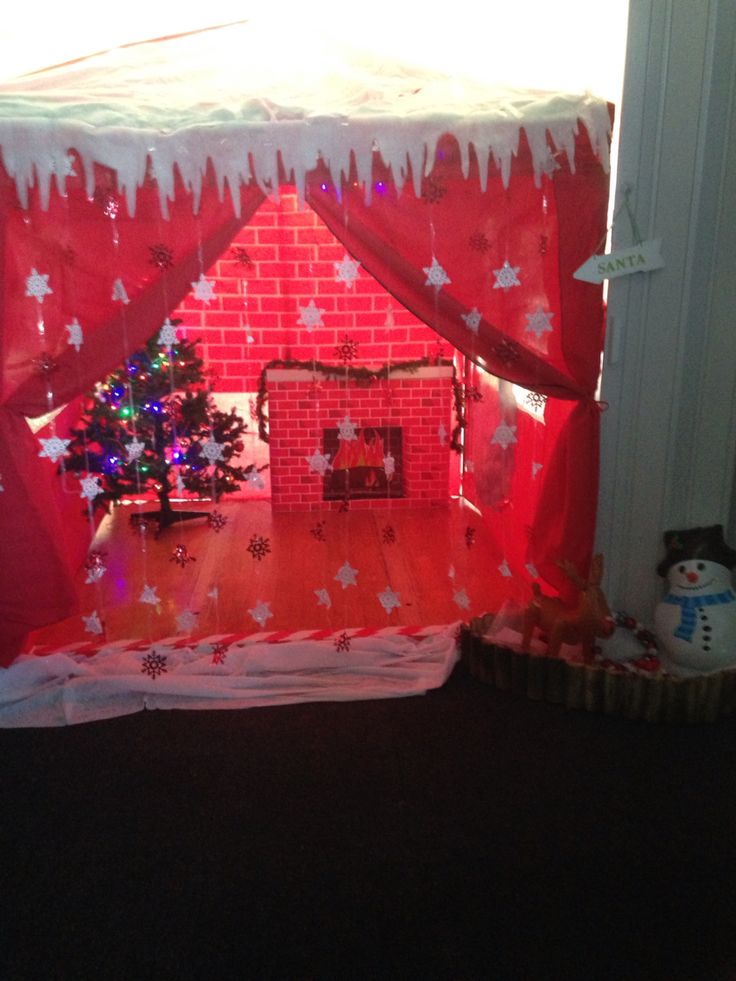 a red and white play tent with christmas decorations