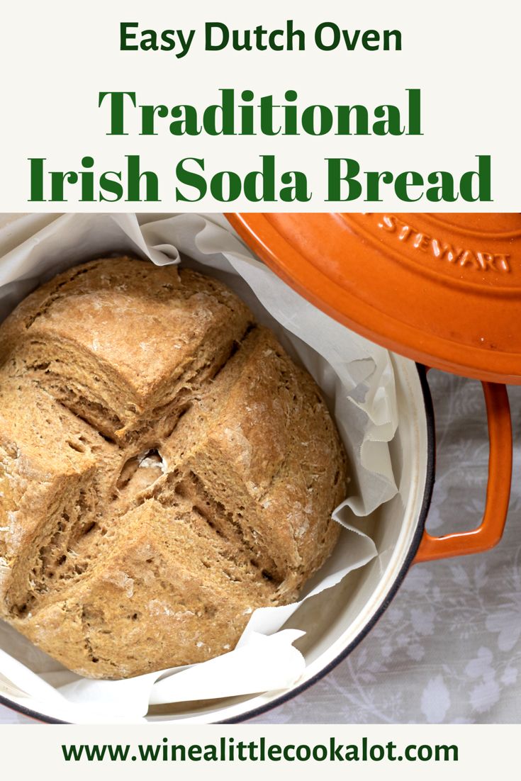 a loaf of irish soda bread in an orange dutch oven with the words easy dutch oven traditional irish soda bread