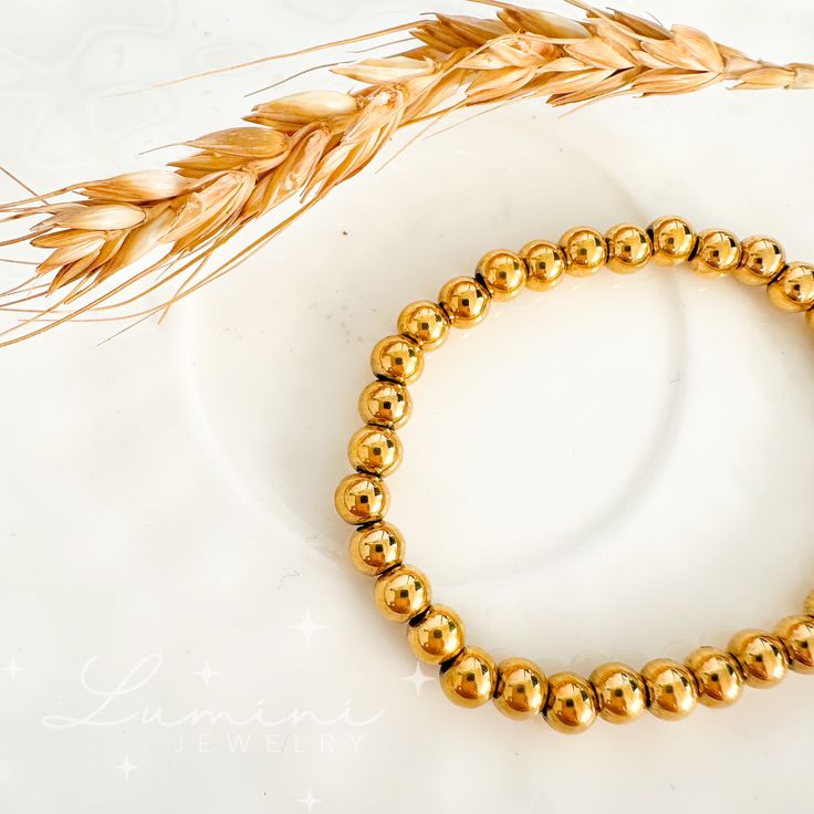 Our Daisy Bead Bracelets are amazing for stacking, adding a splash of charm to any look. They are elastic so they effortlessly fit all wrist sizes, making them a perfect blend of style and versatility. Material: 18k gold plated on stainless steel Size: 3mm-6mm Care: Water-resistant, tarnish-free, hypoallergenic, nickel and lead free Trendy Gold Stretch Bracelet, Hypoallergenic, Gold Trendy Stretch Bracelet With Spacer Beads, Trendy Gold Stretch Bracelet With Spacer Beads, Trendy Gold Stackable Stretch Bracelet, Minimalist Gold Stretch Bracelet With 8mm Beads, Gold Stretch Bracelet With Spacer Beads For Everyday, Everyday Gold Stretch Bracelet With Spacer Beads, Gold Minimalist Stretch Bracelet For Everyday, Trendy Gold Stretch Bracelet With Beads