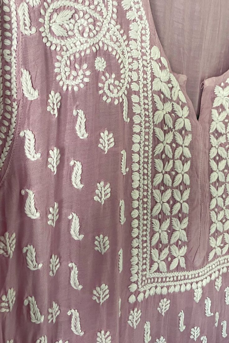 This Purple Muslin Silk Lucknowi Chikankari Ladies Long Straight Kurta is an elegant and versatile choice for any occasion. Made from skin-friendly muslin silk and adorned with intricate Lucknowi chikankari handwork embroidery, it promises both comfort and style. Muslin Silk Length 46" inches Long sleeves 20" inches Round neck Side slit All over handwork Chikankari embroidery Margin: no Dry clean Sharara Suit Pakistani, Phulkari Pants, Lucknowi Kurta, Patiala Salwar Suits, Chikankari Embroidery, Bridal Dupatta, Phulkari Dupatta, Chikankari Suits, Lucknowi Chikankari