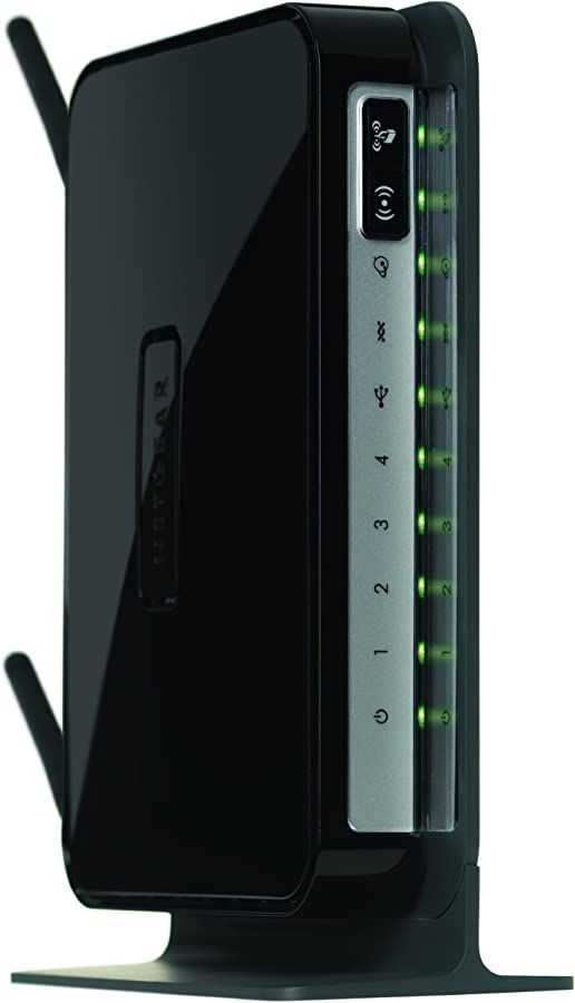 the back side of a black router with green lights on it's sides