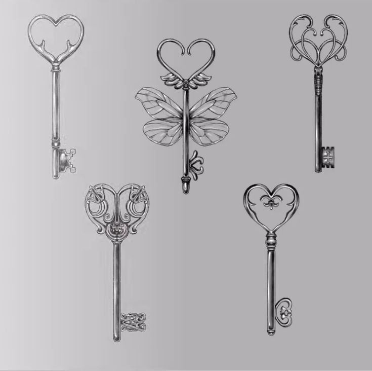 four different keys with hearts on them and two keyholes in the shape of heart