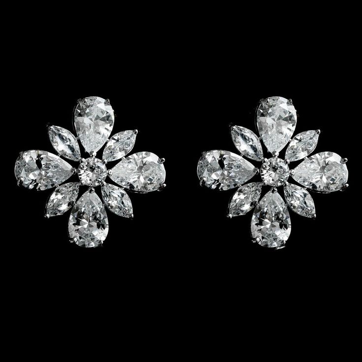 EUNICE EARRINGS: Make a statement with our EUNICE EARRINGS. These floral cluster teardrop and marquise cut stud earrings will add a touch of sophistication to your ensemble and will definitely make a statement for the day. EUNICE EARRINGS will add that finishing sparkle to any style or look. Great Gift Idea for that special someone. DESCRIPTION -AAA Micro Cubic Zirconia -Copper and White Gold Plated. Tarnish-free for brilliance -Lead, Nickel, and Cadmium Free - Measurement: 1.8cm COLORS Availabl Fancy Diamond Earrings, Marquise Earrings, Diamond Pendants Designs, Glamour Nails, Diamond Pendants, Jeweled Earrings, Diamond Necklace Set, Fancy Diamonds, Cubic Zirconia Earrings