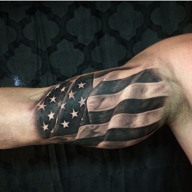 an american flag tattoo on the arm