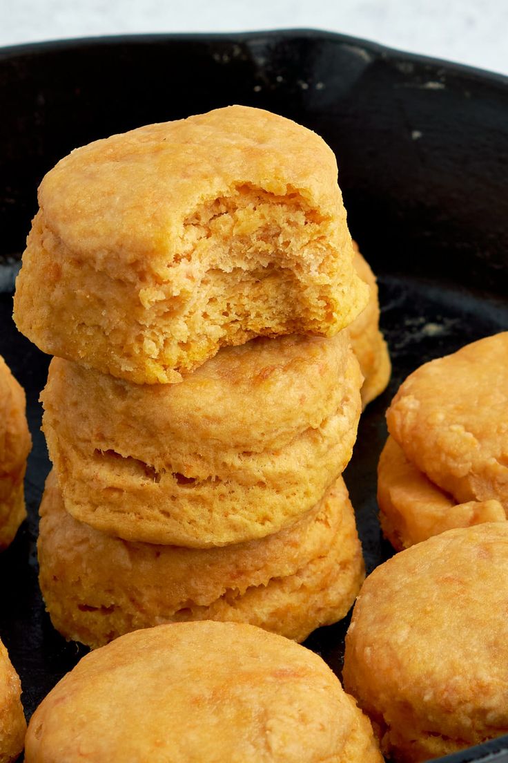 some biscuits are stacked up in a black pan