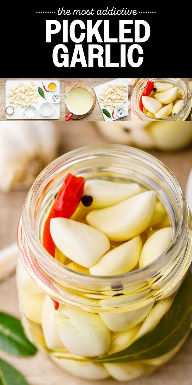 pickled garlic in a glass jar with red peppers and green leaves on the side