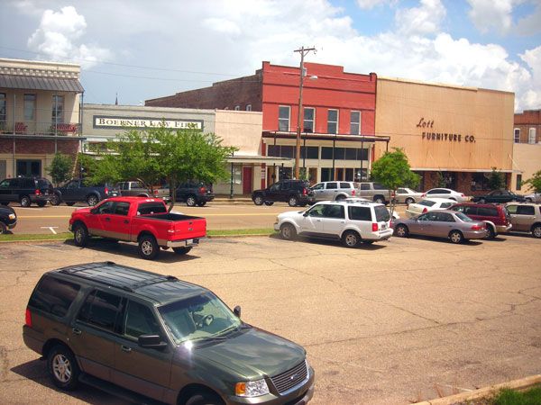 several cars parked in an empty parking lot