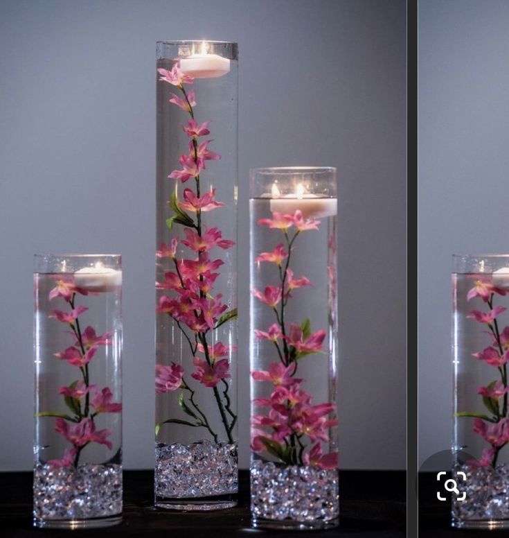 two vases with flowers and candles in them are shown side - by - side