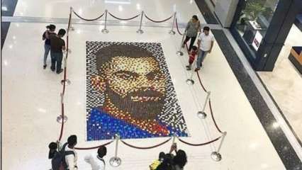 people are standing in front of a mosaic portrait of abraham lincoln at an airport lobby