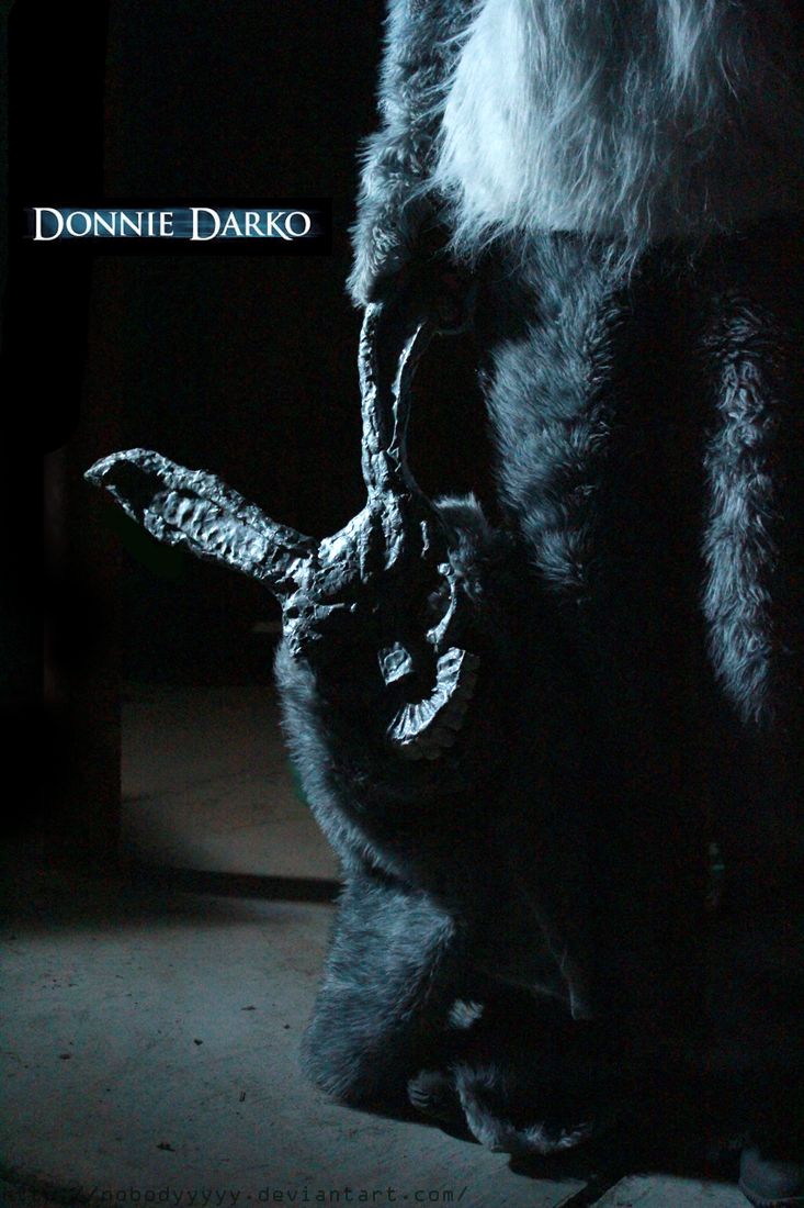 a close up of a stuffed animal in the dark with text above it that reads, donnie darko