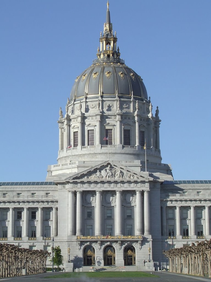 a large white building with a gold dome